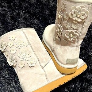 Light grey, flower and crystal decorated Uggs.